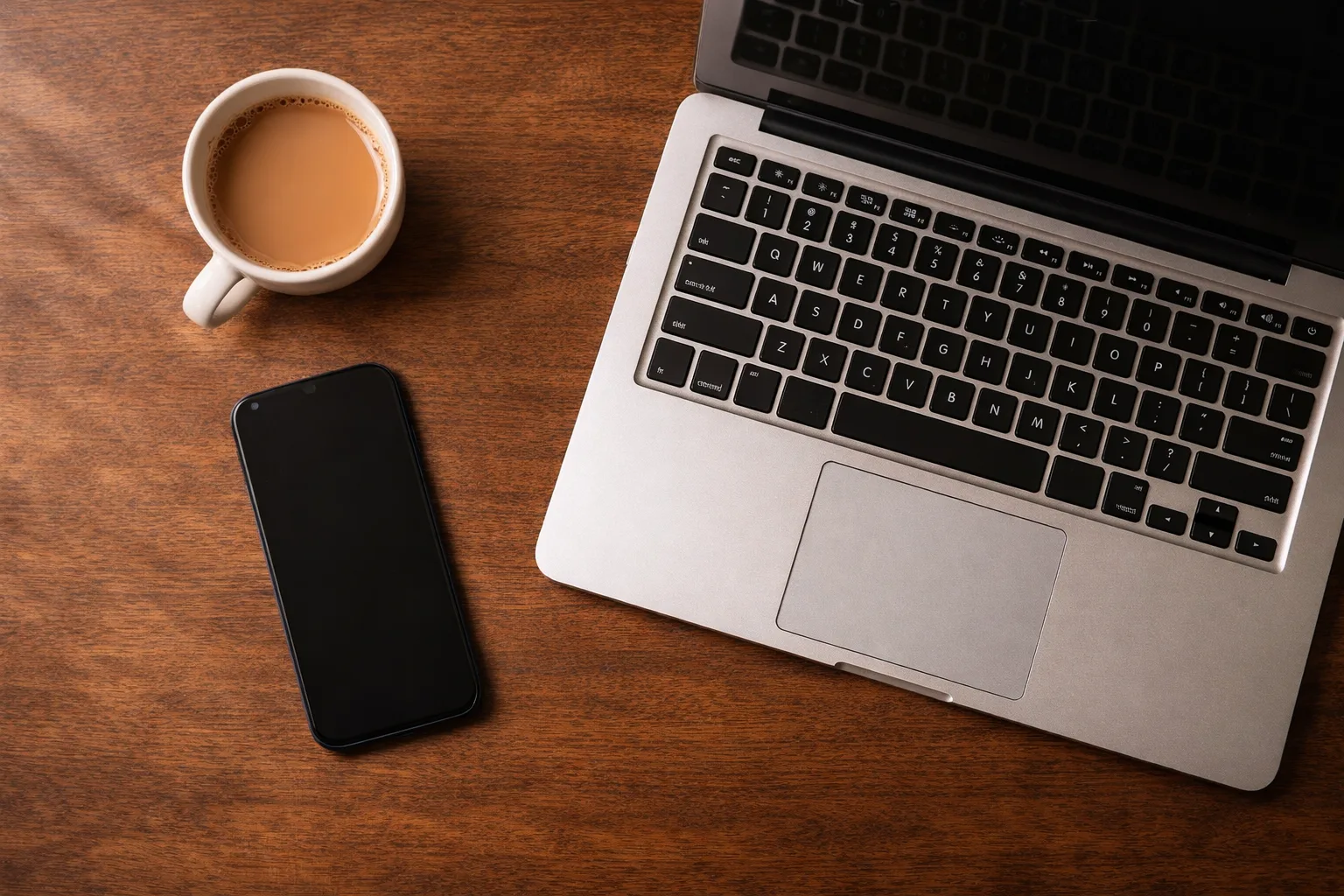 Laptop and phone on desk for Windows ERP